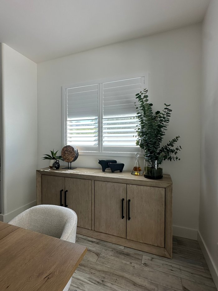 Close view of Norman Woodlore shutters above a dining room sideboard, one finish carried through a Chandler, AZ home