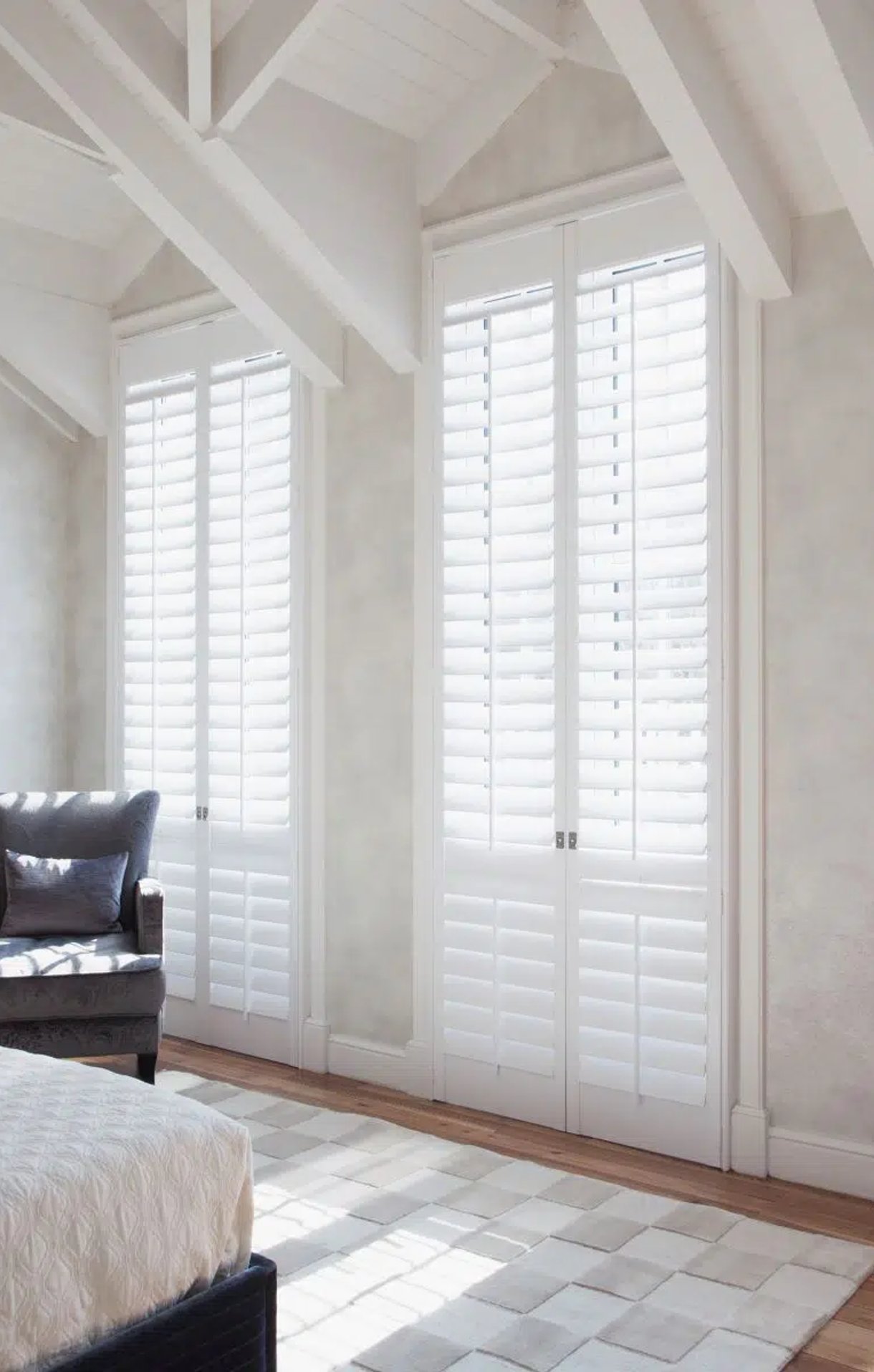 Beautiful living room with Norman Woodlore plantation shutters.