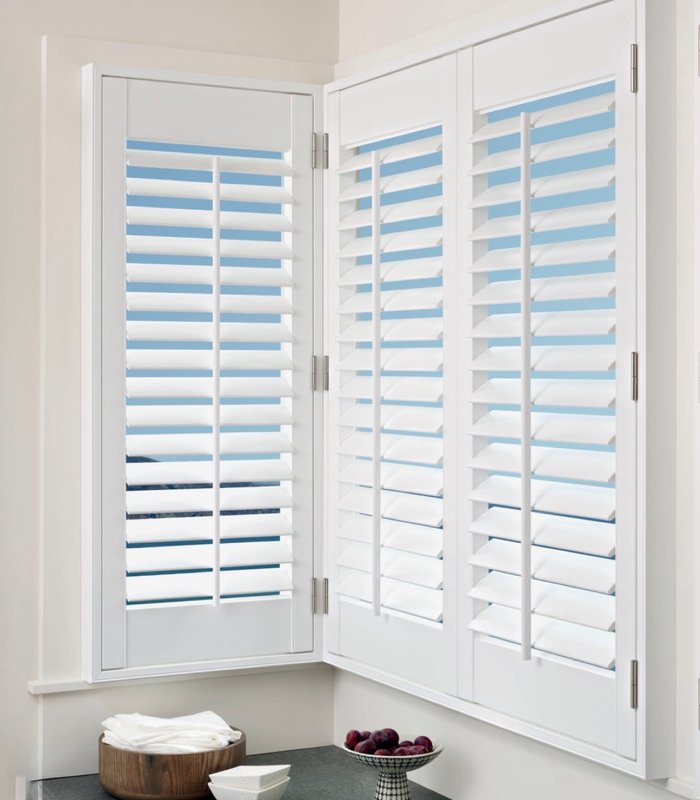 Norman Woodlore shutters on a corner window with 3.5 inch louvers