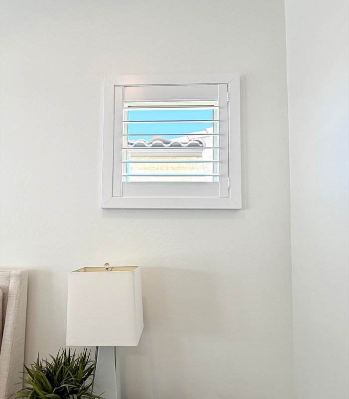 Small accent window fitted with a precisely measured Norman shutter