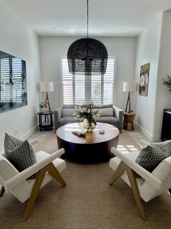 Vaulted living room with Norman Woodlore shutters on the main window, typical of the older Mesa, AZ homes we re-fit