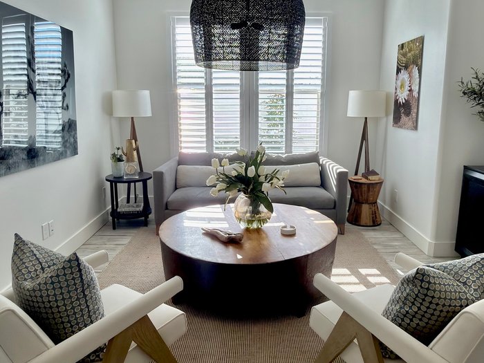 Vaulted living room where the Norman shutters read as part of the wall, the built-in look we specify for Cave Creek, AZ homes