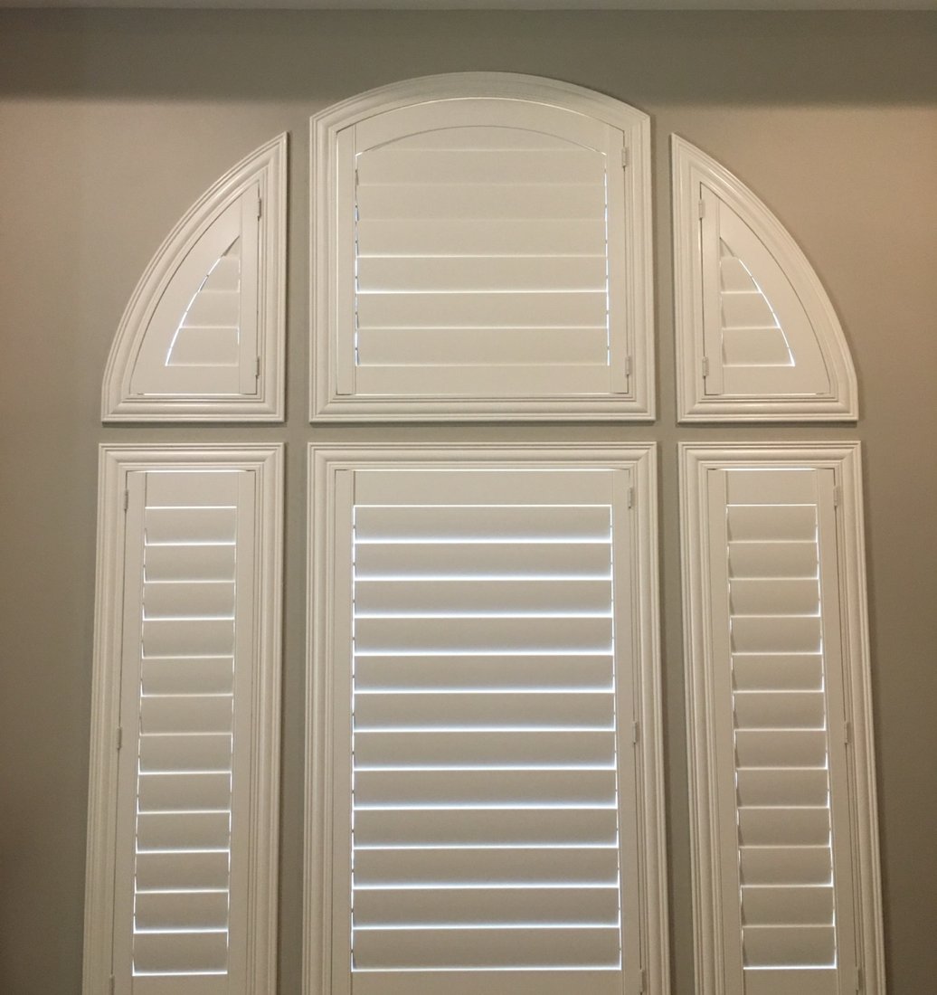 Norman plantation shutters on a large window in a Fountain Hills, AZ home