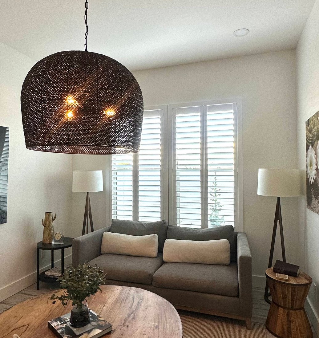 Norman Woodlore plantation shutters closed against the afternoon sun in a Mesa, AZ family room