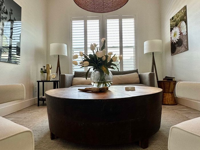 Clean-lined Norman shutters on a two-story living room window, the architectural look Carefree, AZ view homes are after