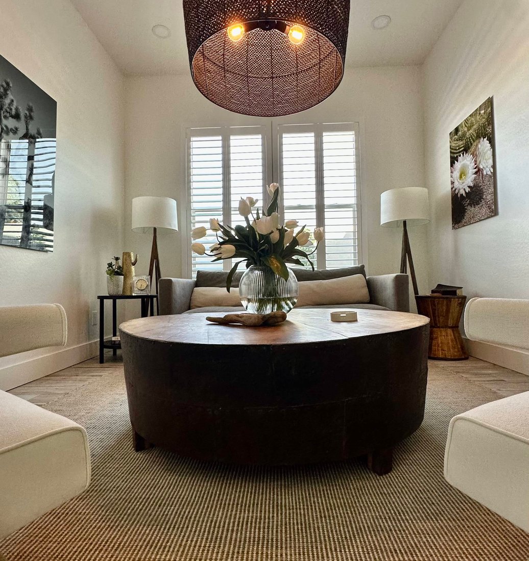 Norman Woodlore plantation shutters on a two-story window wall in a Paradise Valley, AZ home