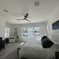 Living room with Norman Woodlore plantation shutters throughout the home