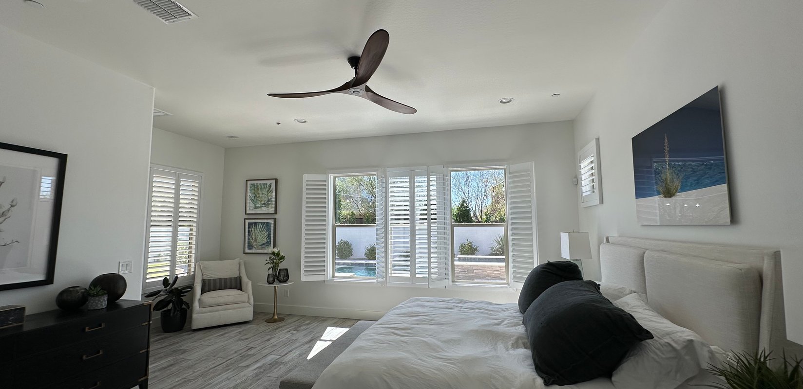 Living room with Norman Woodlore plantation shutters throughout the home