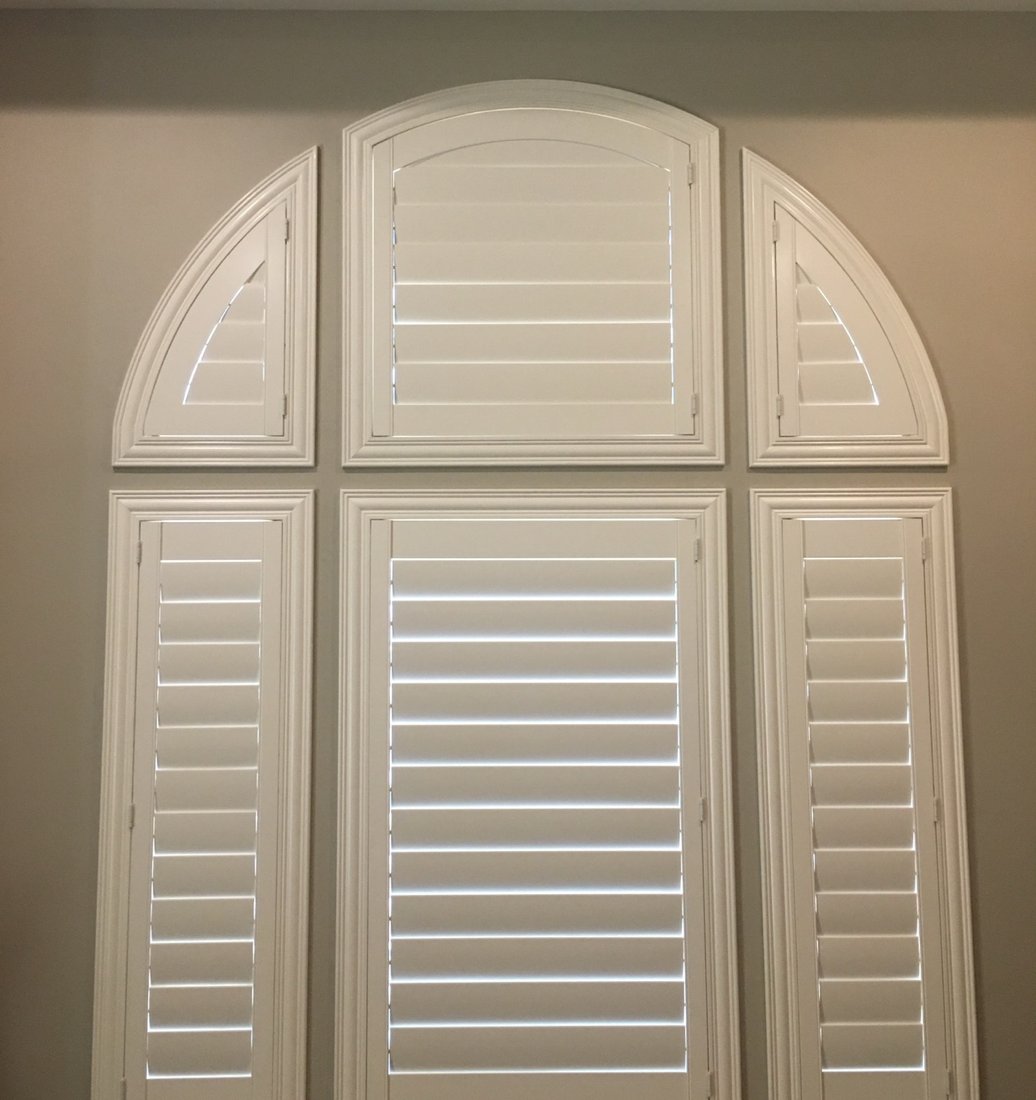 Custom arched Norman plantation shutters in a Carefree, AZ home